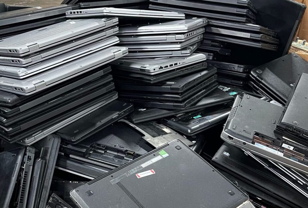 old laptops in pile